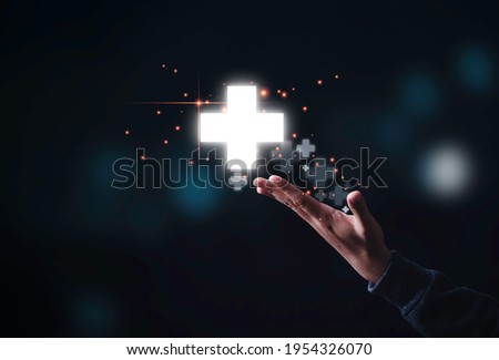 Businessman showing virtual plus sign which it mean positive sign such as add more benefit thinking and mindset concept.