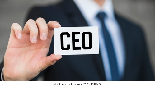 Businessman shows business card with the inscription: CEO - Shutterstock ID 2143118679