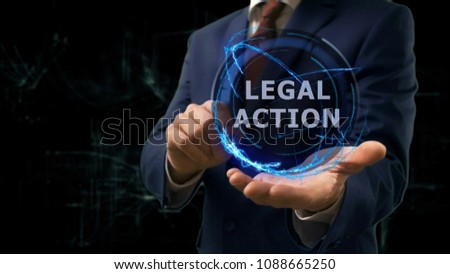 Businessman shows concept hologram Legal action on his hand. Man in business suit with future technology screen and modern cosmic background