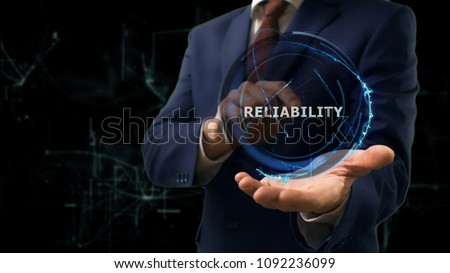 Businessman shows concept hologram Reliability of internet on his hand. Man in business suit with future technology screen and modern cosmic background