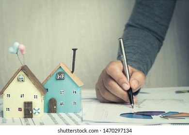 Businessman Signature In Documents Graph Chart Checking Document In Property Investment Project On Desk Office. Report Selling In Mortgage Agent Marketing In Real Estate Concept. Home Driftwood Ideas