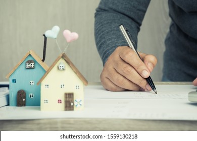 Businessman Signature In Documents Graph Chart Checking Document In Property Investment Project On Desk Office. Report Selling In Mortgage Agent Marketing In Real Estate Concept. Home Driftwood Ideas