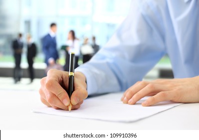 Businessman is signing a contract - Powered by Shutterstock