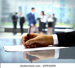 Businessman is signing a contract - Powered by Shutterstock