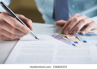 Businessman is signing a contract, business contract details - Shutterstock ID 136826231