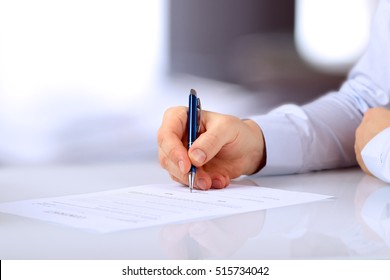 Businessman is signing a contract, business contract details - Shutterstock ID 515734042