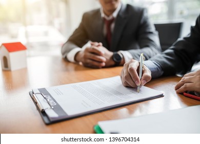 Businessman signing of investment and real estate contract. - Shutterstock ID 1396704314