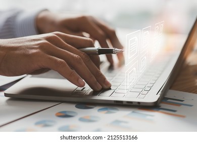 Businessman Signs An Electronic Document On A Digital Document On A Virtual Laptop Computer Screen,Paperless Workplace Idea, E-signing, Electronic Signature, Document Management.