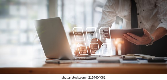 Businessman Signs An Electronic Document On A Digital Document On A Virtual Laptop Computer Screen,Paperless Workplace Idea, E-signing, Electronic Signature, Document Management.