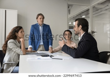 Similar – Image, Stock Photo Young, ambitious coach instructs his players on what to do on the field. Coaching games from behind the line. Mentality and crisis preparedness