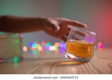 businessman sits and holds glass of liquor in his hand to drink relieve stress after experiencing problems in business. businessman drinking alcohol relieve stress from failed business venture. - Powered by Shutterstock