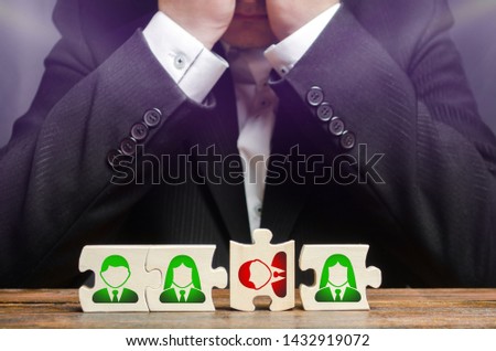 Businessman sitting in despair over the not assembled puzzles symbolizing a team of employees. Toxic or incompetent worker who fails to comply tasks and disrupts the work of a team. Dismissal employee