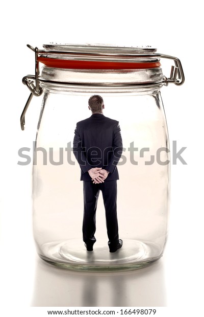 Guy Sits On Glass Jar