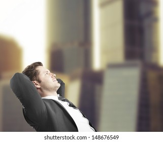 Businessman Sitting In Office And Dreaming