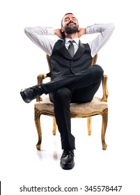 Businessman Sitting On Armchair