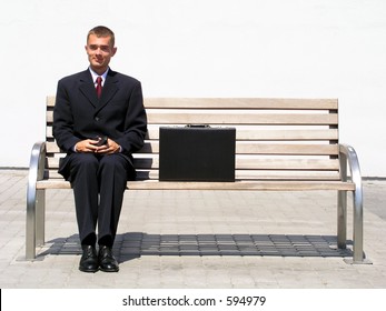 Businessman Sitting On Bench