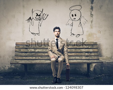 Businessman sitting on a bench with an angel and a devil on his sides