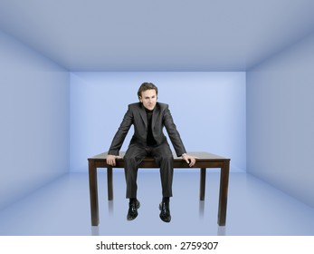 businessman is sitting on his desk in a 3d rendered blue room