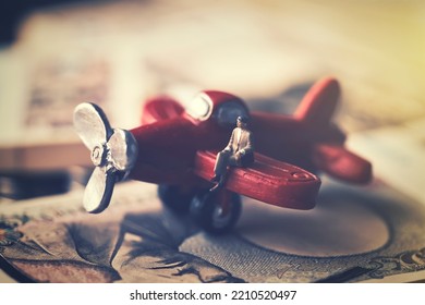 Businessman Sitting On A Red Airplane