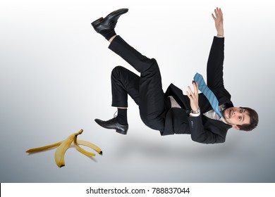 Businessman Slipping On A Banana Peel.