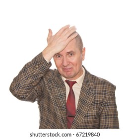 A Businessman Smacking His Forehead. Isolated On White. Body Language. Disappointment. Self-accusation.