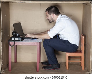 businessman in small office working on laptop