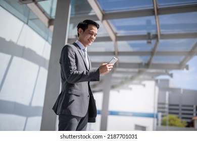 Businessman With Smartphone Walking Against Street Blurred Building Background, Fashion Business Photo Of Beautiful Girl In Casual Suite With Smart Phone.