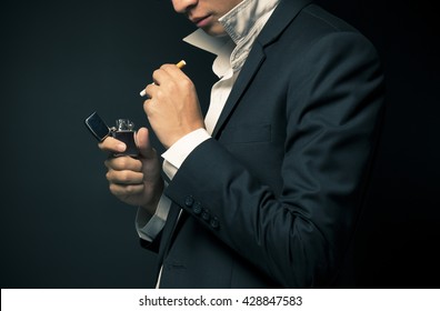Businessman smoking a cigarette