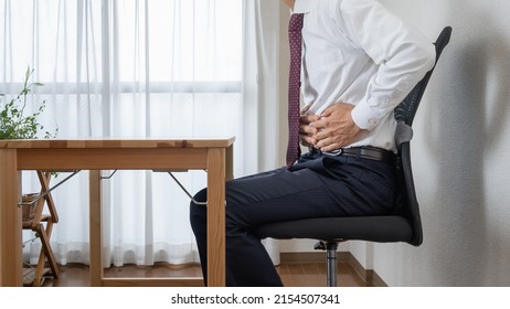 A Businessman With A Sore Stomach.