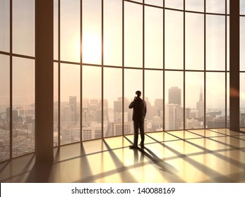 businessman speaking at sunset office - Powered by Shutterstock