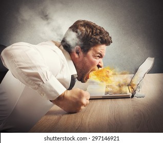 Businessman spits fire and melts the computer