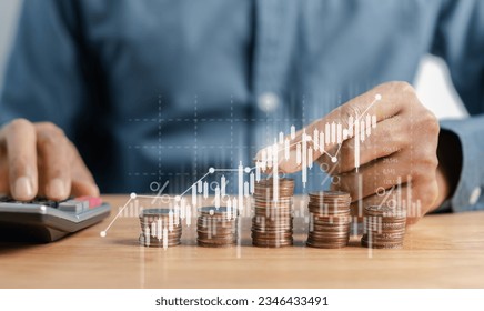 Businessman stacking money coins accounting for increase financial interest rate and business investment growth from dividend, Business Finance and Money, Save money for prepare in the future. - Shutterstock ID 2346433491