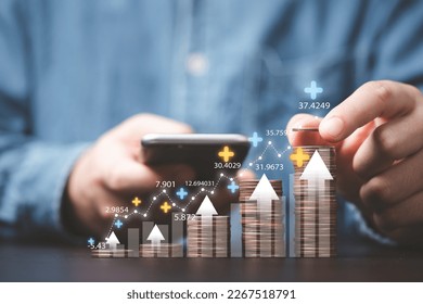 Businessman stacking money coins with up arrow and percentage symbol for financial banking increase interest rate or mortgage investment dividend from business growth concept.