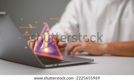 Businessman or it staff , programmer, developer using computer laptop with triangle caution warning sign for notification error and maintenance concept.	