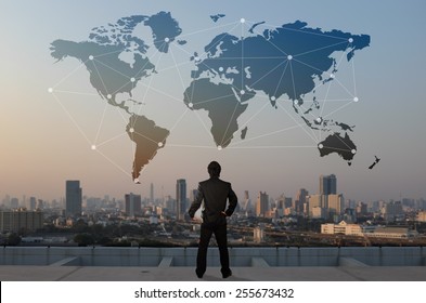 businessman stand on roof top of skyscraper, business globalization concept - Shutterstock ID 255673432
