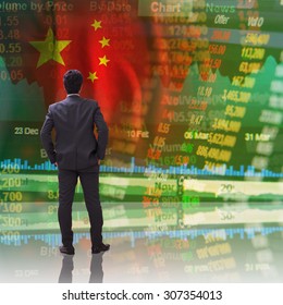 Businessman Standing In Front Of China Stock Market Ticker