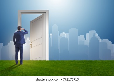 Businessman Standing In Front Of Door Into Future