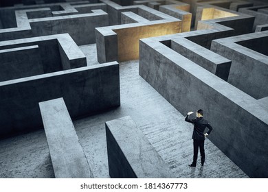 Businessman standing in gray maze. Business and challenge concept. - Shutterstock ID 1814367773