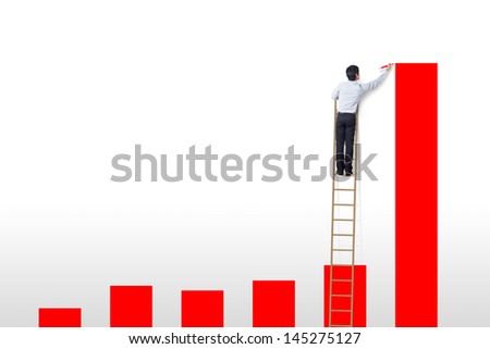 businessman standing on ladder drawing diagrams