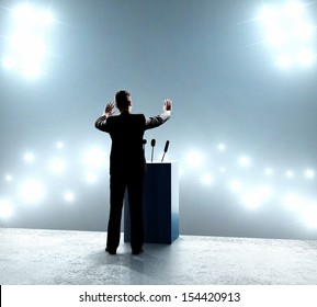 businessman standing on podium and closes on outbreaks - Powered by Shutterstock