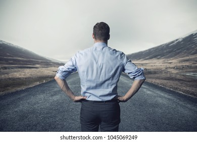 Businessman Standing On The Road. Long Way To Go For Success And Challenge Concept