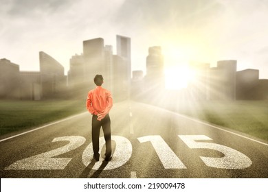 Businessman Standing On The Road And Looking Ahead In 2015