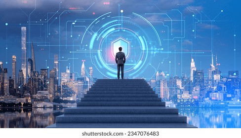 Businessman standing on top of staircase and looking at shield cyber security hologram in night city sky. Concept of cyber security and data privacy and protection in business. Technology and network - Powered by Shutterstock