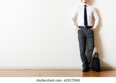 Businessman standing in the room - Shutterstock ID 619172945