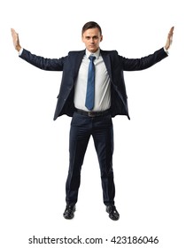 Businessman Stands Pushing Invisible Walls By His Hands. Cutout Portrait. Faith In His Own Strength. Business Staff. To Push The Boundaries Of The Possible. Office Clothes. Believe In Yourself.  Dress