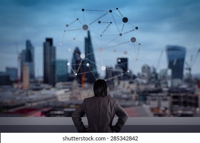 Businessman Stands Successfully On Building Top Looking Towards The Future With Social Media Diagram