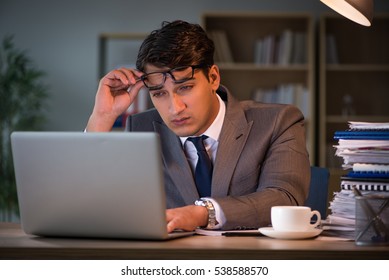 Businessman Staying In The Office For Long Hours