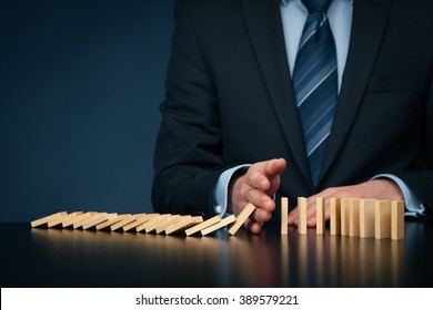 Businessman stop domino effect. Risk management and insurance concept, leadership has solution for problem.
 - Shutterstock ID 389579221