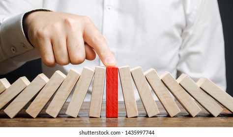 Businessman stops collapse domino effect. Stress resistance business. Financial stability. Recovery business. Evaluation of cash risks. Creating a strategy. Management and planning. Decision making