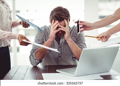 Businessman stressed out at work in casual office - Powered by Shutterstock